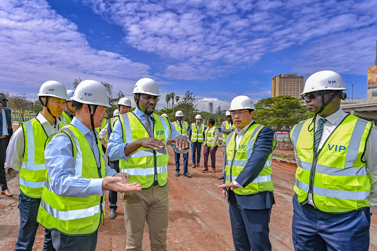 Roads and Transport Cabinet Secretary Kipchumba Murkomen with Engineers as they inspect the Nairobi Expressway on December 21, 2023.