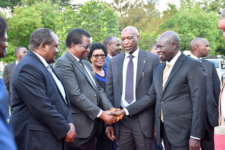 Deputy President Rigathi Gachagua with other leaders at Kenyatta University during the 52nd graduation ceremony.