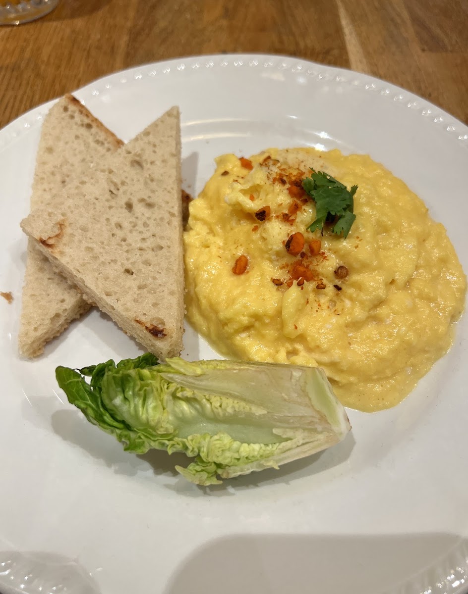 Side of scrambled eggs with gf toast