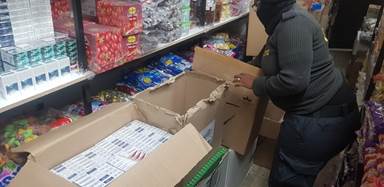 SARS officials seize a massive load of counterfeit cigarettes in a raid on traders in Cape Town.