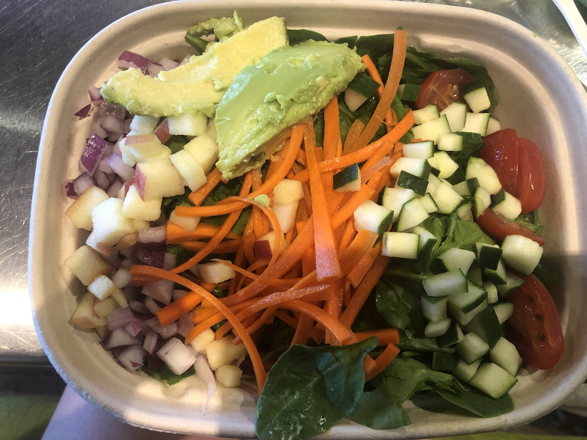 Bowl with a bunch of protein on bottom and veggies and fruit on top!