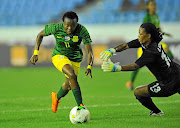 Thembi Kgatlana  of SA dribbles past Lucrecia Bobaila of Equatorial Guinea  during their  African Women's Cup of Nations match  at Cape Coast Stadium, which Banyana won 7-1 /  BackpagePix / Sydney Mahlangu