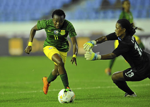 Thembi Kgatlana of SA dribbles past Lucrecia Bobaila of Equatorial Guinea during their African Women's Cup of Nations match at Cape Coast Stadium, which Banyana won 7-1 / BackpagePix / Sydney Mahlangu