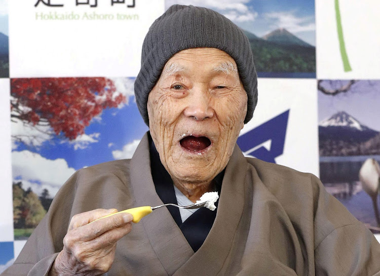 Japanese Masazo Nonaka, who was born 112 years and 259 days ago, eats his favorite cake as he receives a Guinness World Records certificate naming him the world's oldest man during a ceremony in Ashoro, on Japan's northern island of Hokkaido, April 10, 2018.