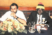 Anti-apartheid activists Trevor Manuel and Oscar Mpetha at a United Democratic Front meeting in the 1980s. Mpetha's son, Themba, voted in Nyanga, Cape Town, on May 8 2019. File photo