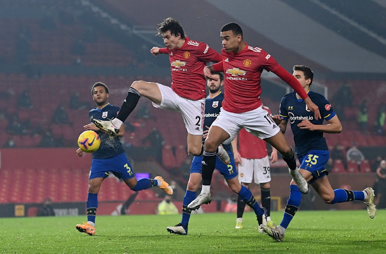 Manchester United's Victor Lindelof and Mason Greenwood in action.