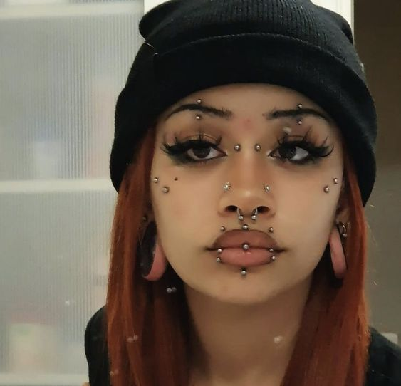 Close up view of a girl rocking her face piercings