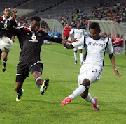 Orlando Pirates Siyabonga Sangweni  with Bidvest Wits  player Getaneh Kebede  at Orlando Stadium in Soweto. Picture: ANTONIO MUCHAVE/SOWETAN