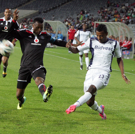 Orlando Pirates Siyabonga Sangweni with Bidvest Wits player Getaneh Kebede at Orlando Stadium in Soweto. Picture: ANTONIO MUCHAVE/SOWETAN