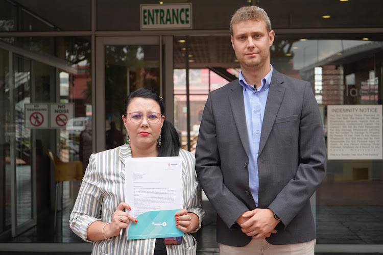 AfriForum's manager for education, Carien Bloem, and the organisation's head of youth, sport and culture, Henk Maree, outside Gauteng premier David Makhura's office in Johannesburg.