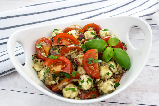 Caprese Salad With Quinoa and Brown Rice in a serving bowl.