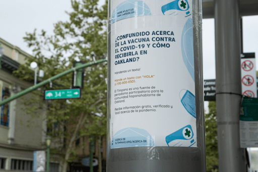 Spanish language vaccine poster. Photo Amir Aziz