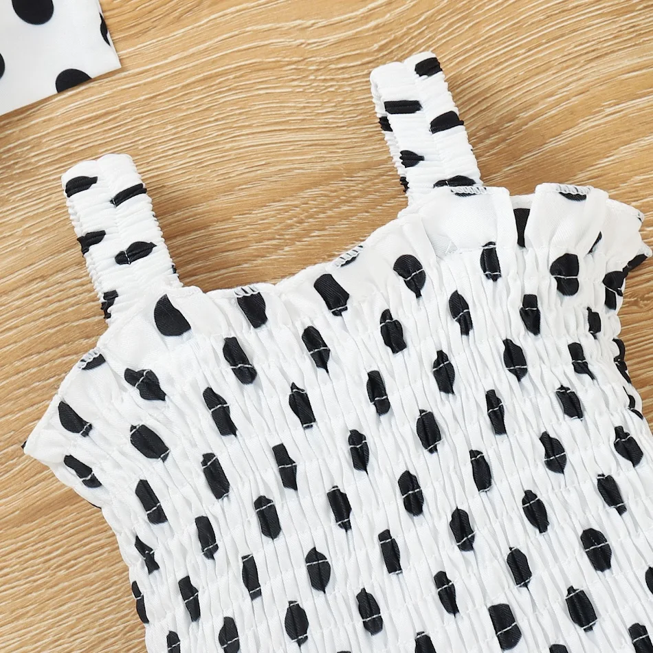 Dot Monito de una pieza con nudo en la cabeza, ideal para bebés. Suave, cómodo y fácil de poner, perfecto para jugar y dormir con estilo.