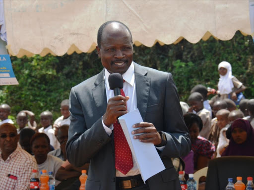 Migori Governor Zachary Obado Okoth addresses the gathering during the launch of Measles Rubella campaign at Migori Muslim Primary school yesterday.