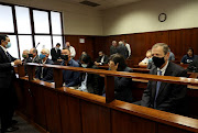 Peter Staude, Murray Munro, Michael Deighton, Rory Wilkinson, Kamlasagrie Singh, Samantha Shula, and Gavin Kruger in the dock at the Durban specialised commercial crimes court on Thursday during their fraud matter. 