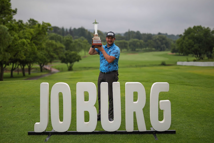 Thriston Lawrence holds the trophy after winning the 2021 Joburg Open at Randpark Golf Club in Johannesburg on Novermber 27 2021.