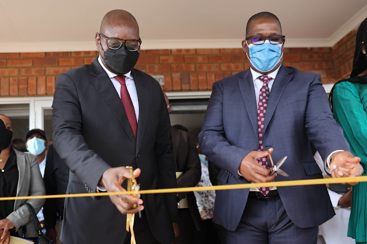 Gauteng premier David Makhura, left, and MEC for education and youth development Panyaza Lesufi cut a ribbon to officially open Setlabotjha Primary School in Sebokeng, south of Joburg, during the first day of the academic year on January 12 2022.