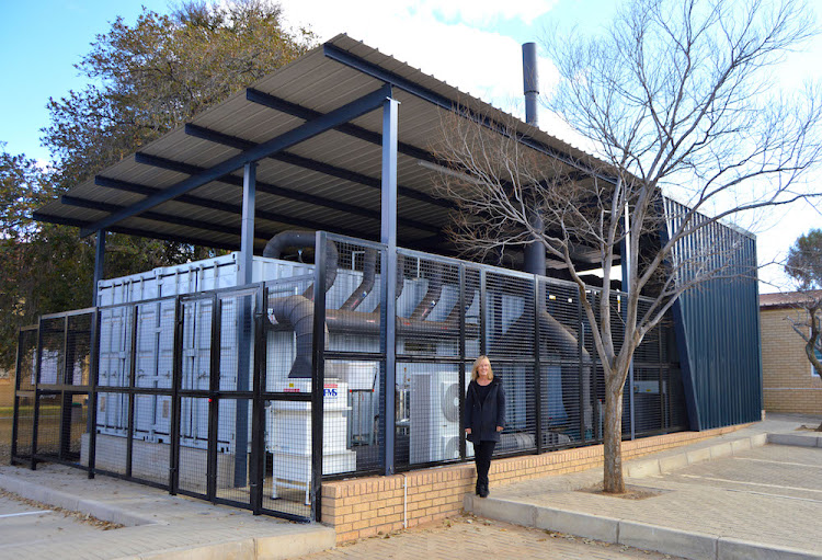 The repurposed shipping containers were lifted by crane over trees and onto a concrete platform on the Bloemfontein Campus of the UFS before it was transferred into the biosafety level 3 laboratory. Picture: SUPPLIED