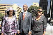 LOOKING TO THE FUTURE:  City of Johannesburg mayor Parks Tau, with the speaker of the council, councillor Connie Bapela, left, and the mayor's wife Philisiwe  Twala-Tau.  PHOTO: ENOCH LEHUNG