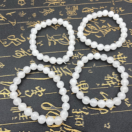 Title 3, Natural white marble bracelet featuring transpa...