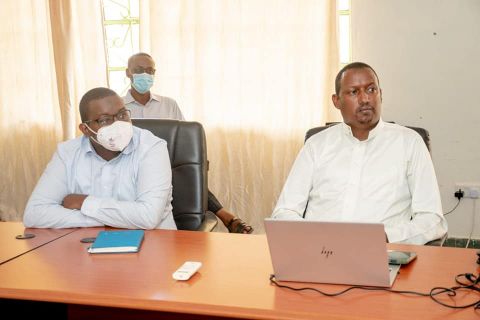 Lt Col Martin Maluki and Garissa county director of Livestoc Haret Hambe listen to livestock farmers during a one-day sensitisation meeting on the new KMC procurement plan for Garissa on Saturday, May 1.