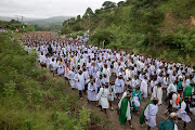Thousands of Ebuhleni Nazareth Baptist Church members walking to eKhenani mountain in Ozwathini, KwaZulu-Natal, to which they made their annual holy pilgrimage. 