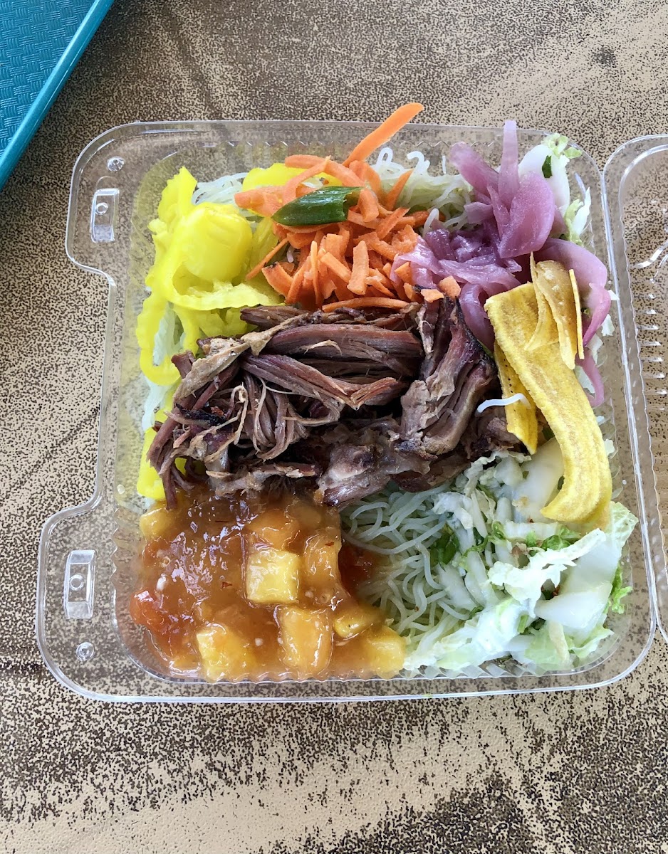 Tropical style bowl with cilantro noodles, Kailua pork, fruit medley, cole slaw, banana peppers, carrots, pickled onions.