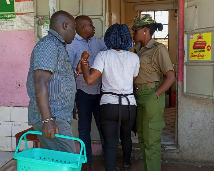 Nema officers arrest a trader found with the banned plastic bags at Njoro market, Nakuru county, January 18, 2023.