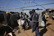 Siezed explosives are seen on the floor. The police conducted a multi-stakeholder operation in Matholesville, near Roodepoort. File photo 