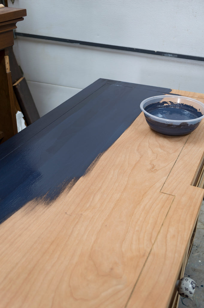 first coat of milk paint / 80's sideboard modern makeover