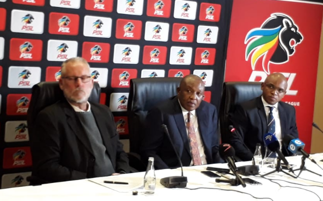 Premier Soccer League (PSL) chairman Irvin Khoza is flanked by two senior officials of the League Prof. Ronnie Schloss (L) and spokesperson Lux September during a media briefing at the PSL Offices in Parktown, north of Johannesburg on Thursday July 12 2018.