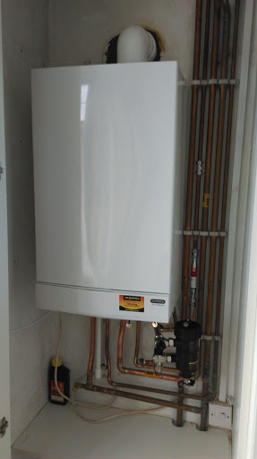 New Potterton Titanium combi with magnetic filter in bedroom cupboard.