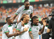 William Troost-Ekong of Nigeria (centre) celebrates his goal during the 2023 Africa Cup of Nations match against Ivory Coast at the Alassane Ouattara Stadium in Abidjan.