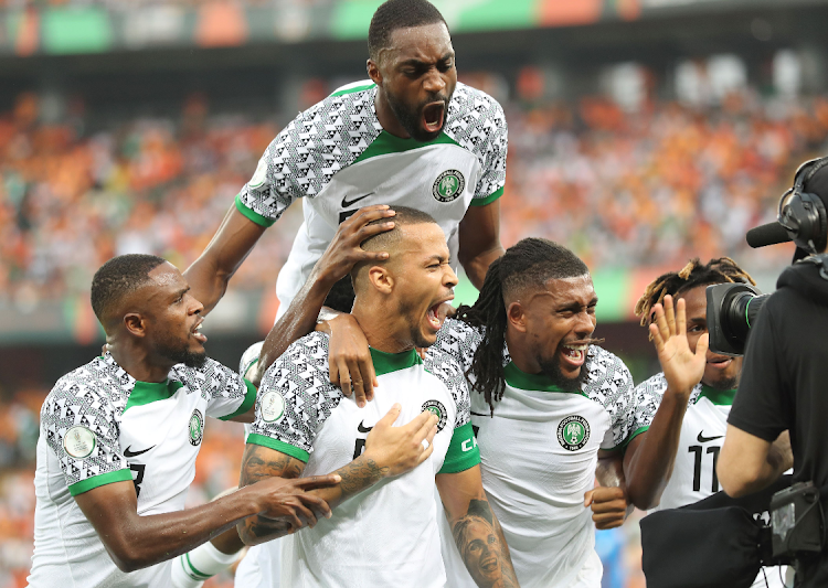 William Troost-Ekong of Nigeria (centre) celebrates his goal during the 2023 Africa Cup of Nations match against Ivory Coast at the Alassane Ouattara Stadium in Abidjan.