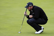 Shane Lowry of Ireland lines up a putt on the 18th green during the first round of the 148th Open Championship held on the Dunluce Links at Royal Portrush Golf Club on July 18, 2019 in Portrush, United Kingdom. 