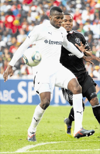 NEEDS GAME TIME: Tottenham Hotspur defender Bongani Khumalo shields the ball from Pirates striker Rudolf Bester in their Vodacom Challenge encounter. Photo: Veli Nhlapo