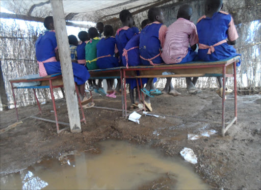 GOOD EDUCATION? Pupils of Katuwit Primary School in Tiaty subounty. Their classrooms got flooded following heavy rains on Friday last week.Photo/Joseph Kangogo