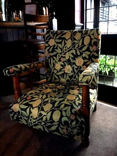 The Crown Inn in Chiddingfold, Surrey had a couple of their 1950s oak armchairs polished and re-upholstered by Paul in a William Morris fruit tapestry weave.