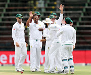 South Africa pace bowler Vernon Philander celebrates with teammates after wicketkeeper Quinton de Kock catches out Kannur Lokesh Rahul of India during the third and final test of the 2018 Sunfoil Test Series at Wanderers Stadium, Johannesburg South Africa on 24 January 2018. South Africa hold an unassailable 2-0 lead in the three-match test series. 