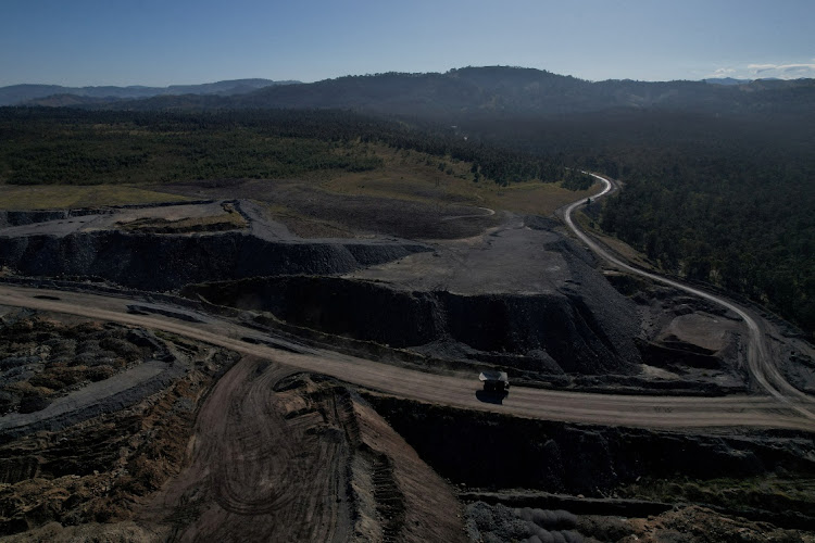 The edge of Glencore's Mount Owen coal mine and adjacent rehabilitated land in a drone image in Ravensworth, Australia on June 21, 2022. File Picture: REUTERS/Loren Elliott