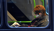 A man on a bus in London is seen wearing a protective face mask, as the spread of the coronavirus disease (Covid-19) continues.